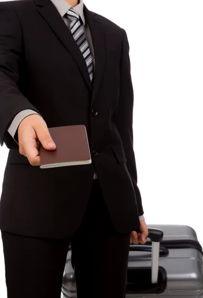 Business man traveling pulling suitcase and holding passport — Stock Photo, Image