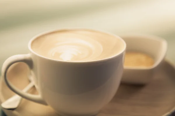 Hot latte art coffee on table — Stock Photo, Image