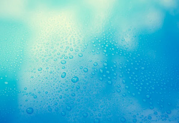 Drops of water on blue floor — Stock Photo, Image