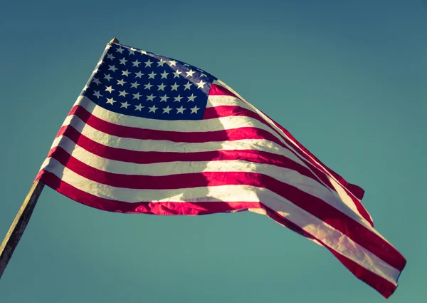 American flag over blue sky — Stock Photo, Image