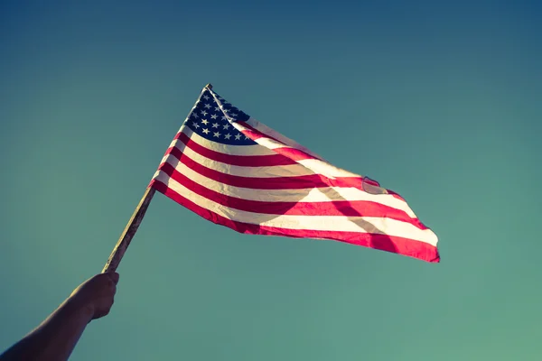 American flag with stars and stripes hold with hand — Stock Photo, Image