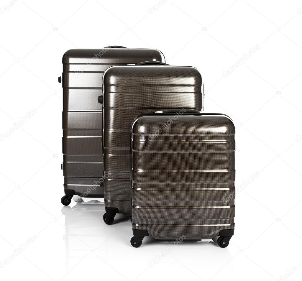 three brown Suitcases