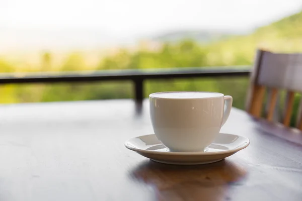 Coffee in cup on table — Stock Photo, Image