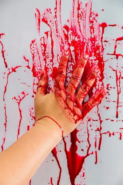 Hand in blood on wall — Stock Photo, Image