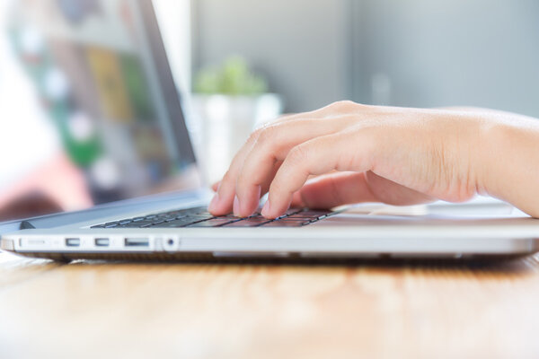 woman typing on keyboard