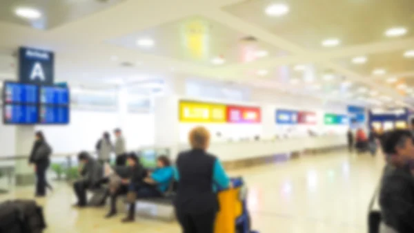 Passengers in airport terminal — Stock Photo, Image