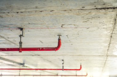 Fire sprinkler and red pipes clipart