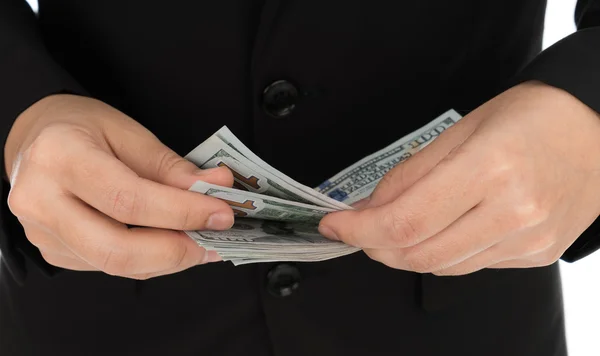 Бізнесмен тримає банкноти доларів — стокове фото