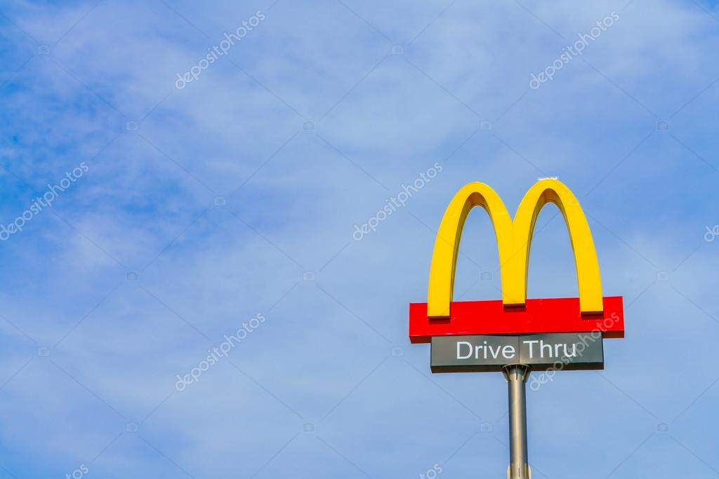 KHONKAEN PROVICE, THAILAND - 20, DECEMBER, 2015 : McDonalds logo on blue sky McDonald's Corporation is the world's largest chain of hamburger fast food restaurants.