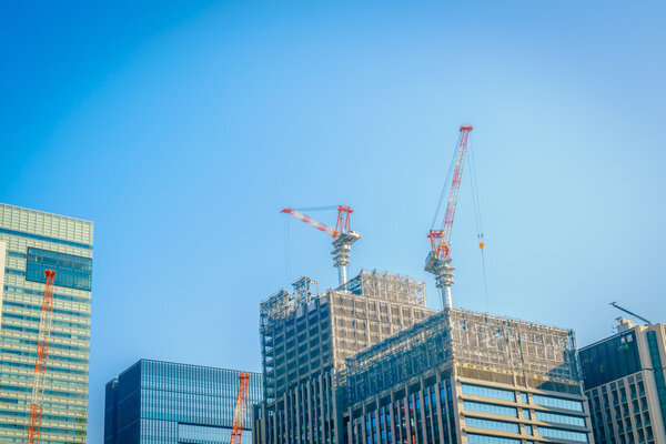 Cranes and building construction site