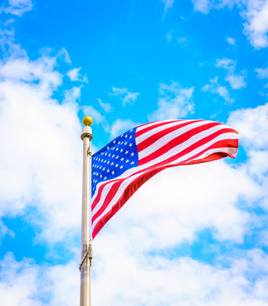 American flag on blue sky