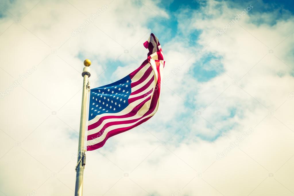 American flag on blue sky