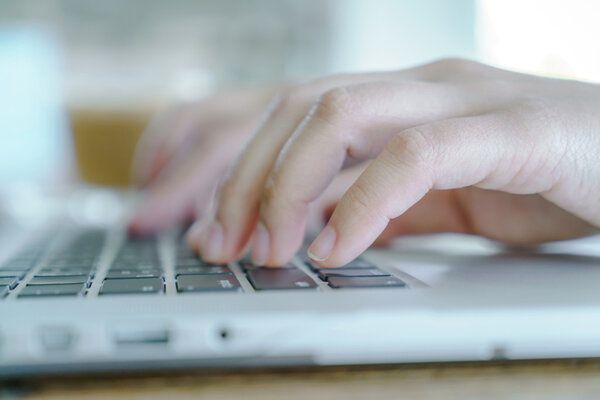 woman typing on keyboard