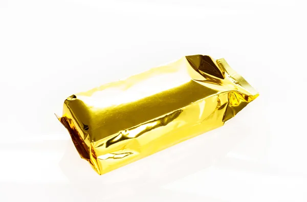 Golden foil bag package on white background — Stock Photo, Image