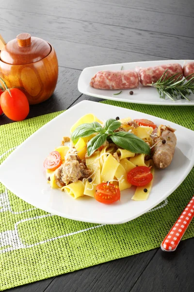 Pasta with sausages ragout and parmesan — Stock Photo, Image