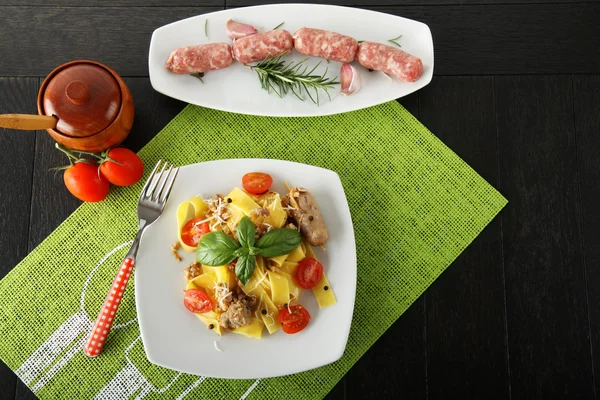 Pasta with sausages ragout and parmesan — Stock Photo, Image