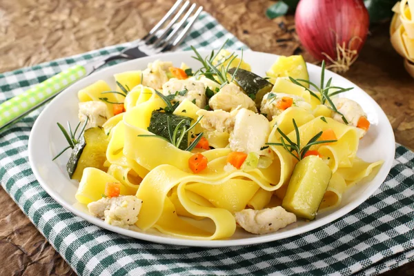 Pasta with fish, zucchini and carrots — Stock Photo, Image