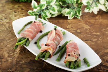 Roulade of bacon and beans clipart