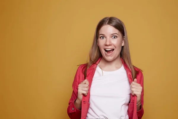 Happy Smiling Caucasian Woman Holds Jacket Plain White Shirt Shows Imágenes de stock libres de derechos