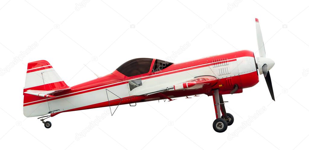 Side view of red aerobatic sports aircraft with piston engine with propeller. Isolated on white background 