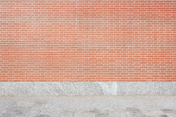 Röd tegelvägg och sten klinkergolv bakgrund — Stockfoto