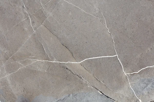 Grauer Stein Textur Hintergrund mit weißen Adern — Stockfoto