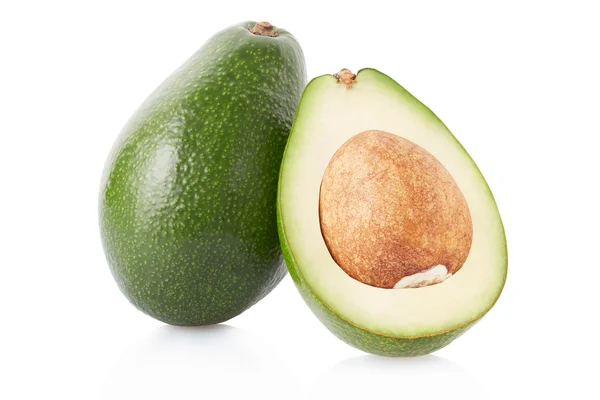 Avocado en sectie op wit, uitknippad — Stockfoto