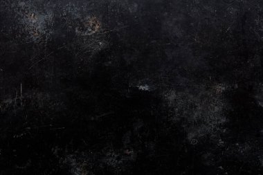 Black, scratched and old metal texture background 