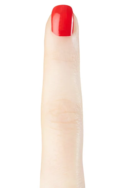 Dedo femenino con manicura esmalte de uñas rojo — Foto de Stock