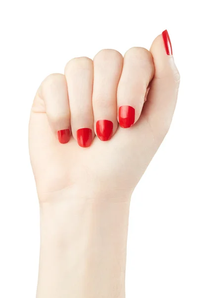 Manicura en mano femenina con esmalte de uñas rojo sobre blanco —  Fotos de Stock