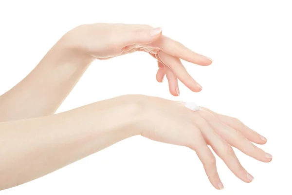 Female hands with cream on white — 图库照片