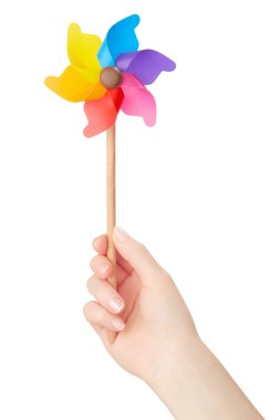 Kadın el beyaz renkli fırıldak tutarak