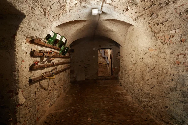 Old, dark basement corridor in ancient house — Stockfoto