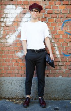 Man poses for photographers before Fendi show, Milan fashion week