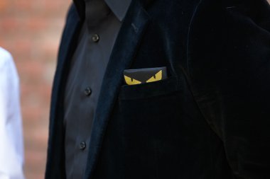 Man poses for photographers before Fendi show, Milan fashion week