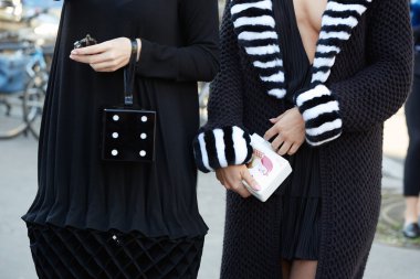 Women poses for photographers before Rochas show, Paris fashion week