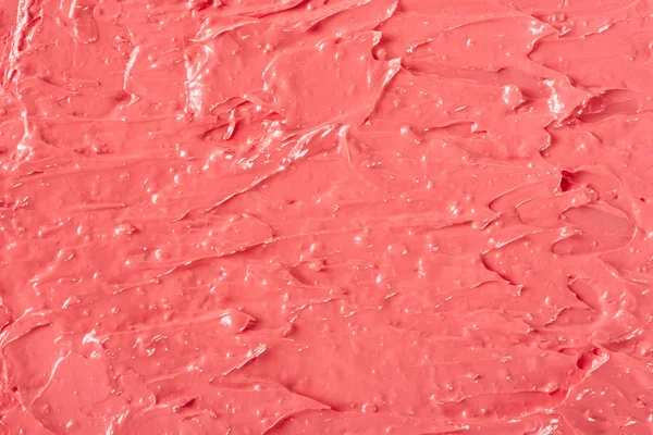 Läppstift röd korall färg konsistens bakgrund — Stockfoto
