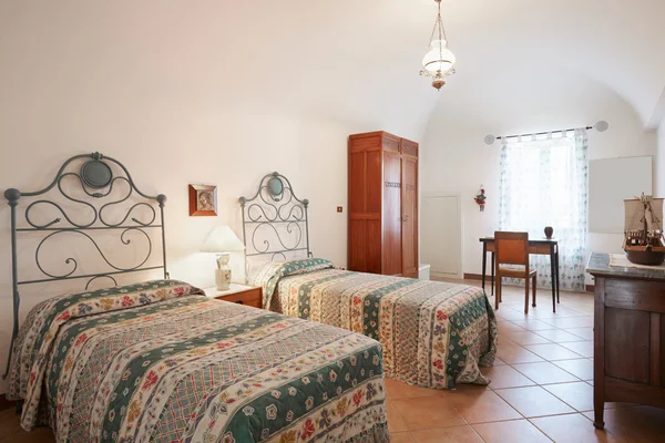 Old bedroom with two beds in ancient house — Stock Photo, Image