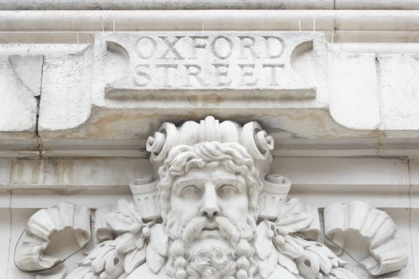 Ancient Oxford street sign in white stone in London — Stock Photo, Image