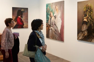 Artissima, contemporary art fair opening with women looking artworks