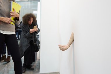 Artissima, contemporary art fair opening, people and hand sculpture