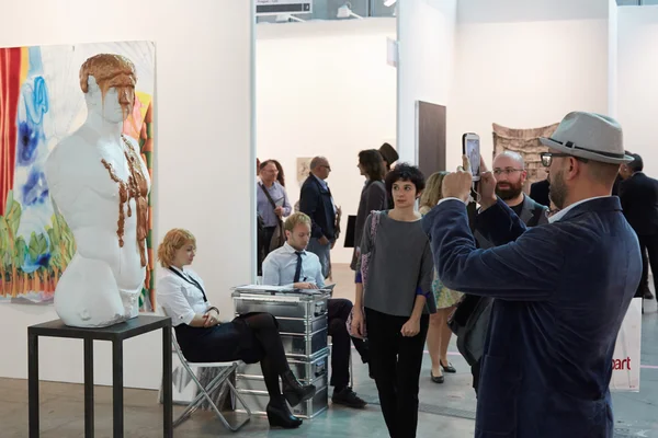 Artissima, contemporary art fair opening, man shooting photos to artworks — стокове фото