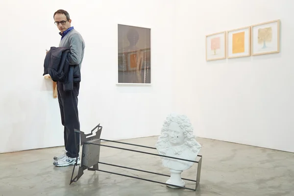 Artissima, contemporary art fair, man looking artworks — стокове фото