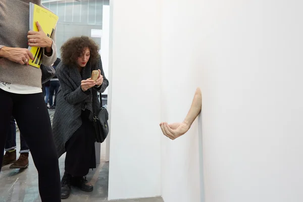 Artissima, contemporary art fair opening, people and hand sculpture — стокове фото