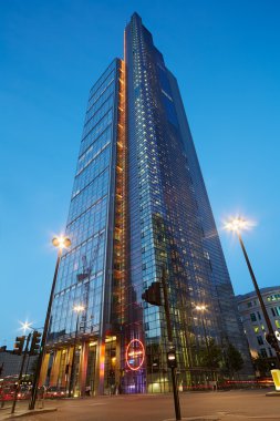 The Heron tower skyscraper illuminated in the evening in London