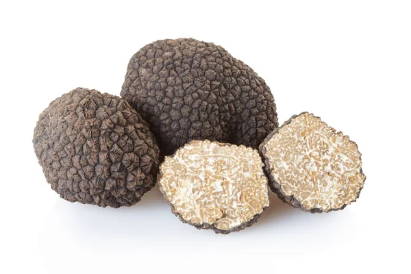 Black truffles group and section on white — Stockfoto