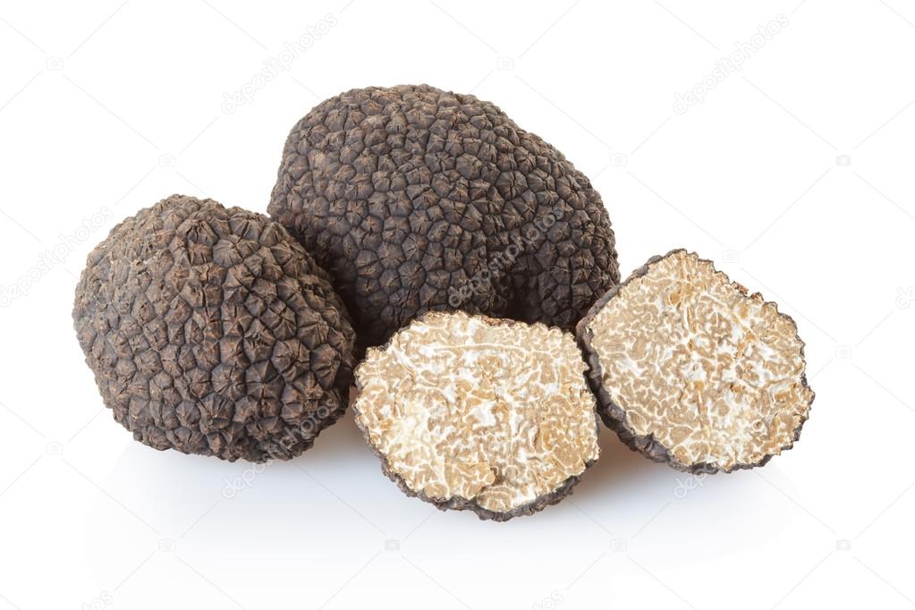 Black truffles group and section on white