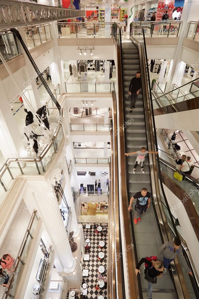 Selfridges department store interior with escalators in London Stock