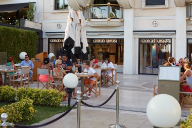 Giorgio Armani cafe with people in Cannes clipart