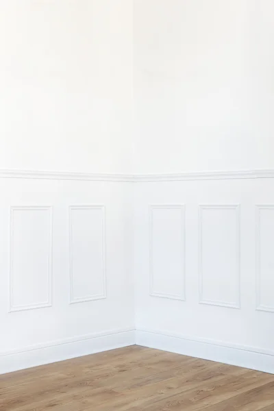 Empty white room corner with parquet floor and wood trimmed wall — Stock Image Empty white room corner with parquet floor and wood trimmed wall Royalty Free Stock Images